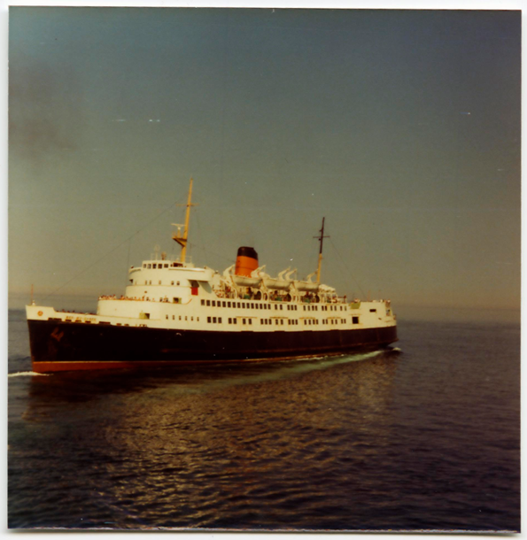 A colour photo of the fifth Steam Packet Company vessel to bear the name Ben-my-Chree in calm waters