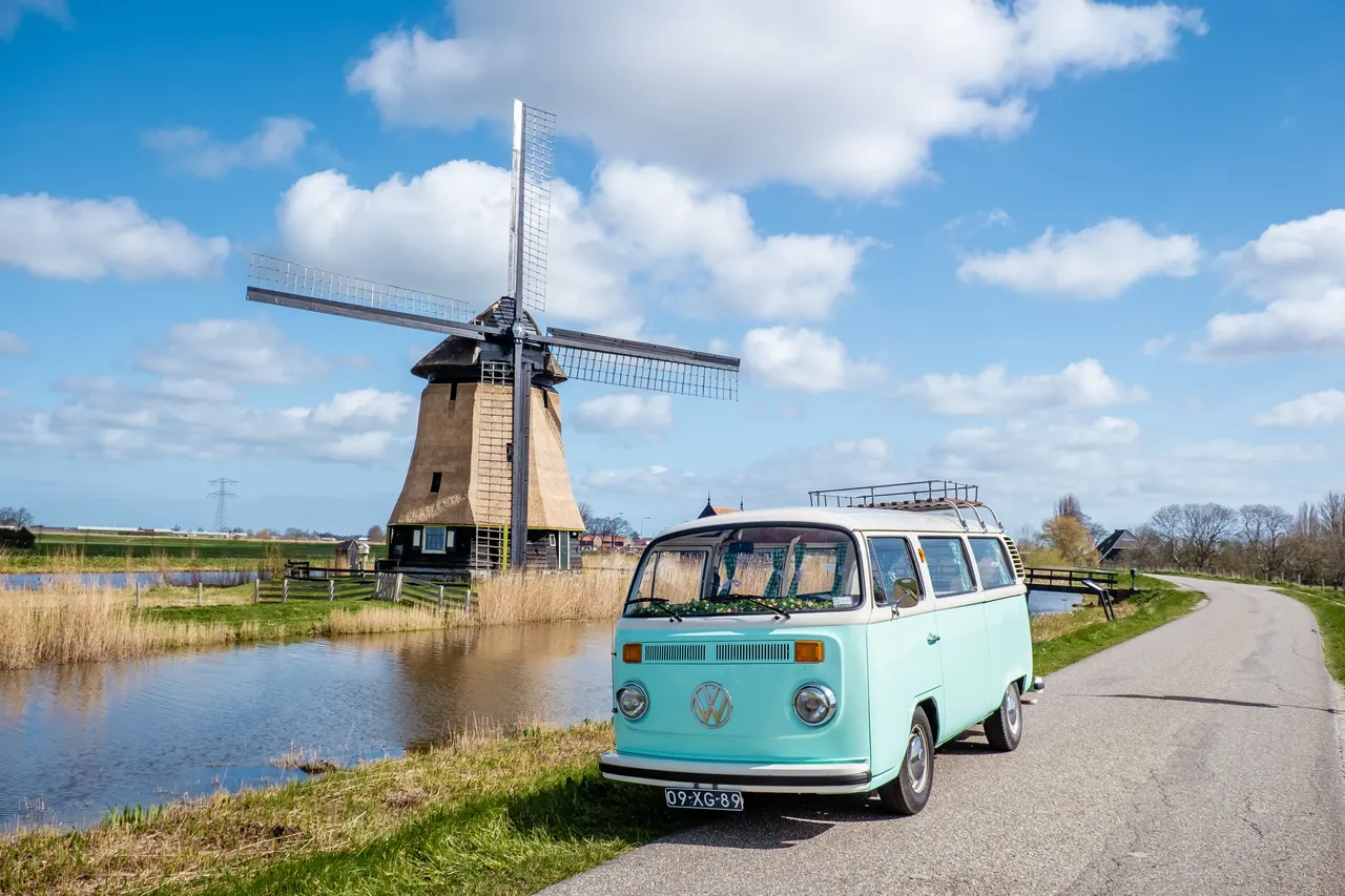 A campervan beside a windmill in Holland - credit Fokke Baarssen