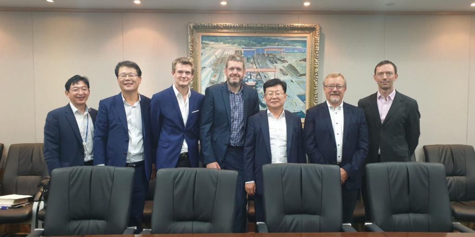 Group photo of the Hyundai and Steam Packet Company team. Hyundai Mipo Dockyard Head Office, July 2020. (L-R) SD Yoon (Hyundai), YH Yeo (Hyundai), Nick Wood (Ship Broker – Affinity), Jim Royston (Project Manager – Steam Packet Company), SY Park (Executive Vice President – Hyundai), Simon Pressly (Non-Executive Director – Steam Packet Company), David Wing (Naval Architect – Houlder)*