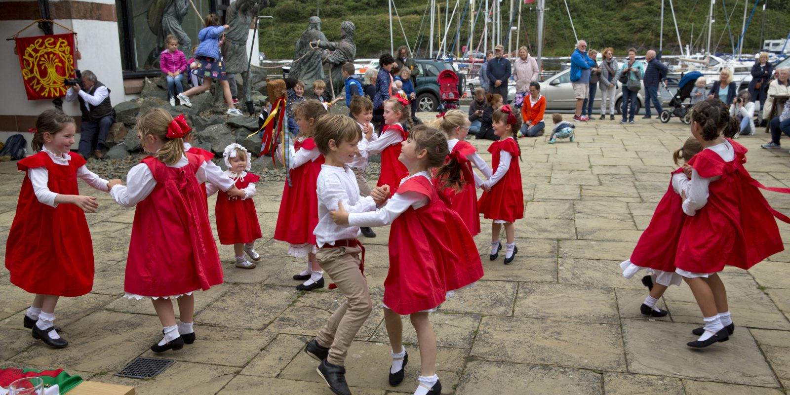 Children dancing Celtic dances dressed in white and red